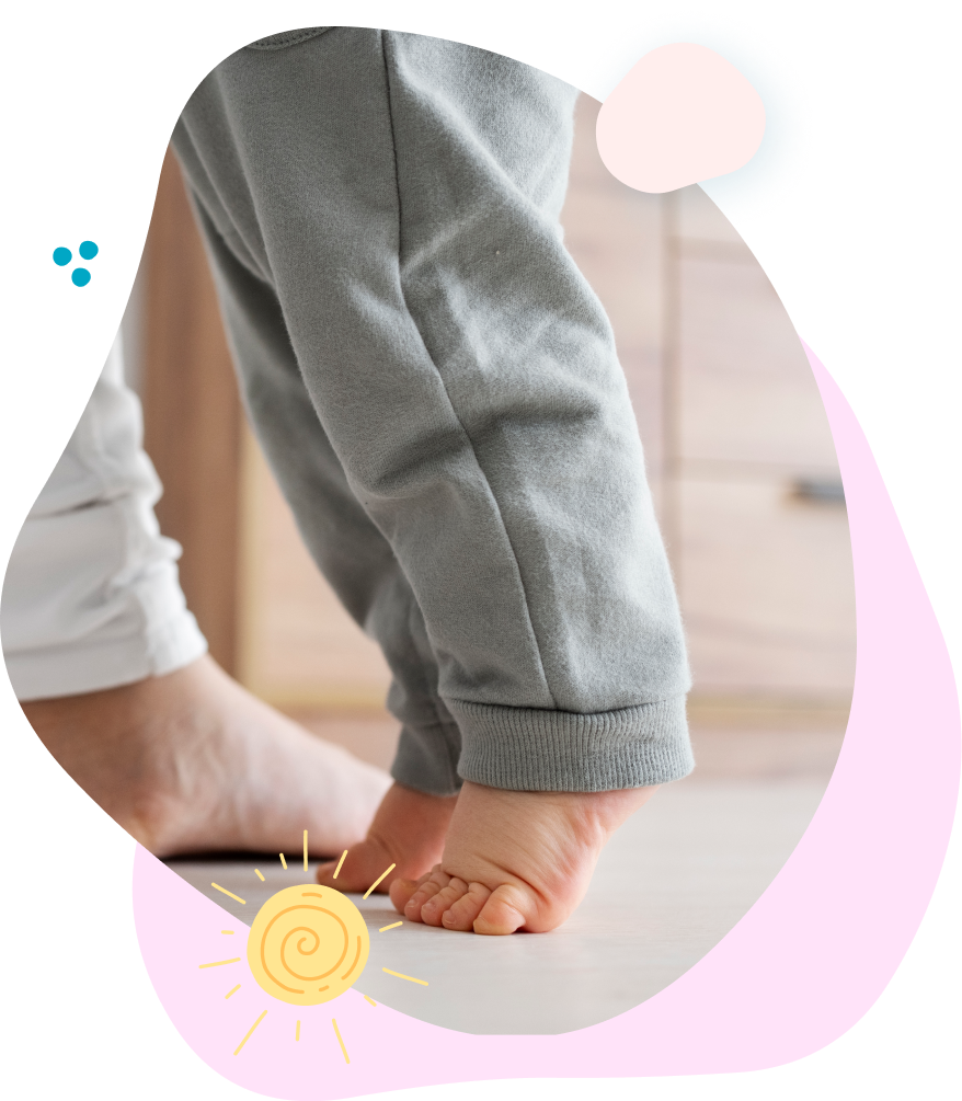 A woman is holding a little girl 's hand in a hospital room.