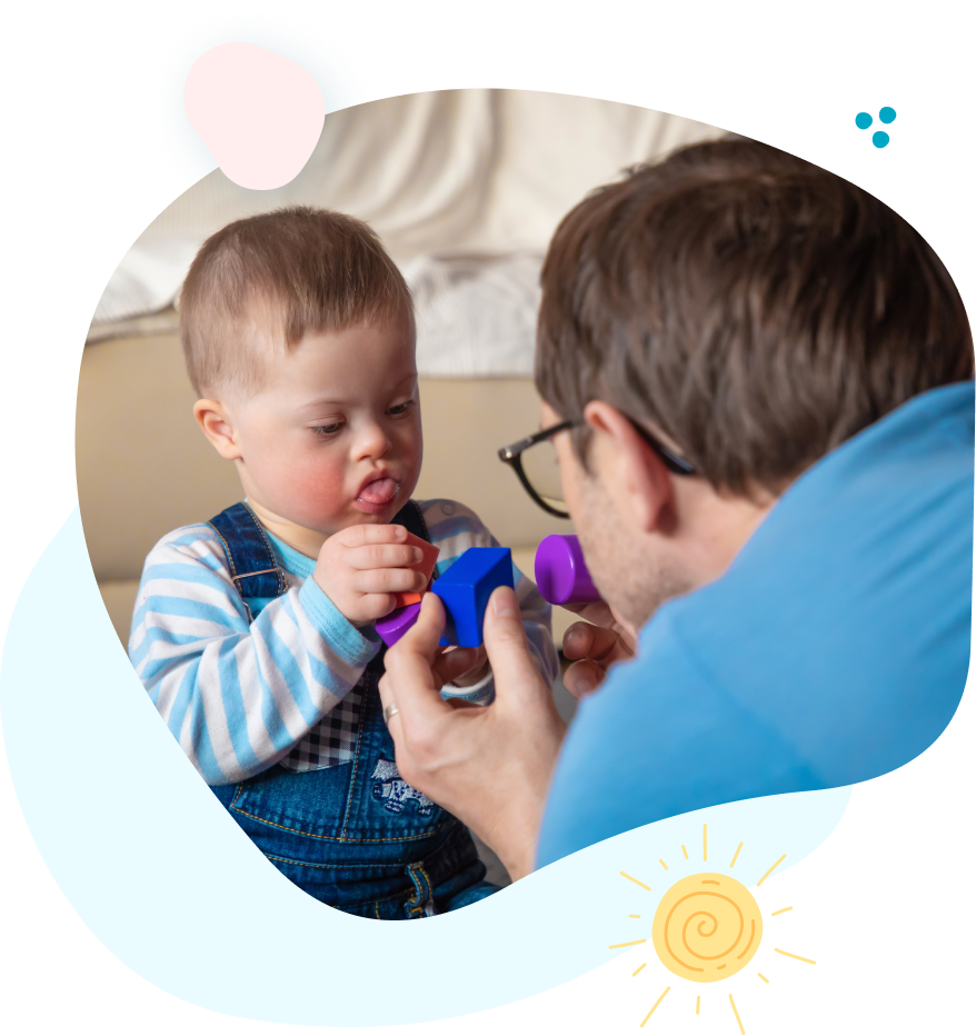 A man and a baby are playing with blocks.