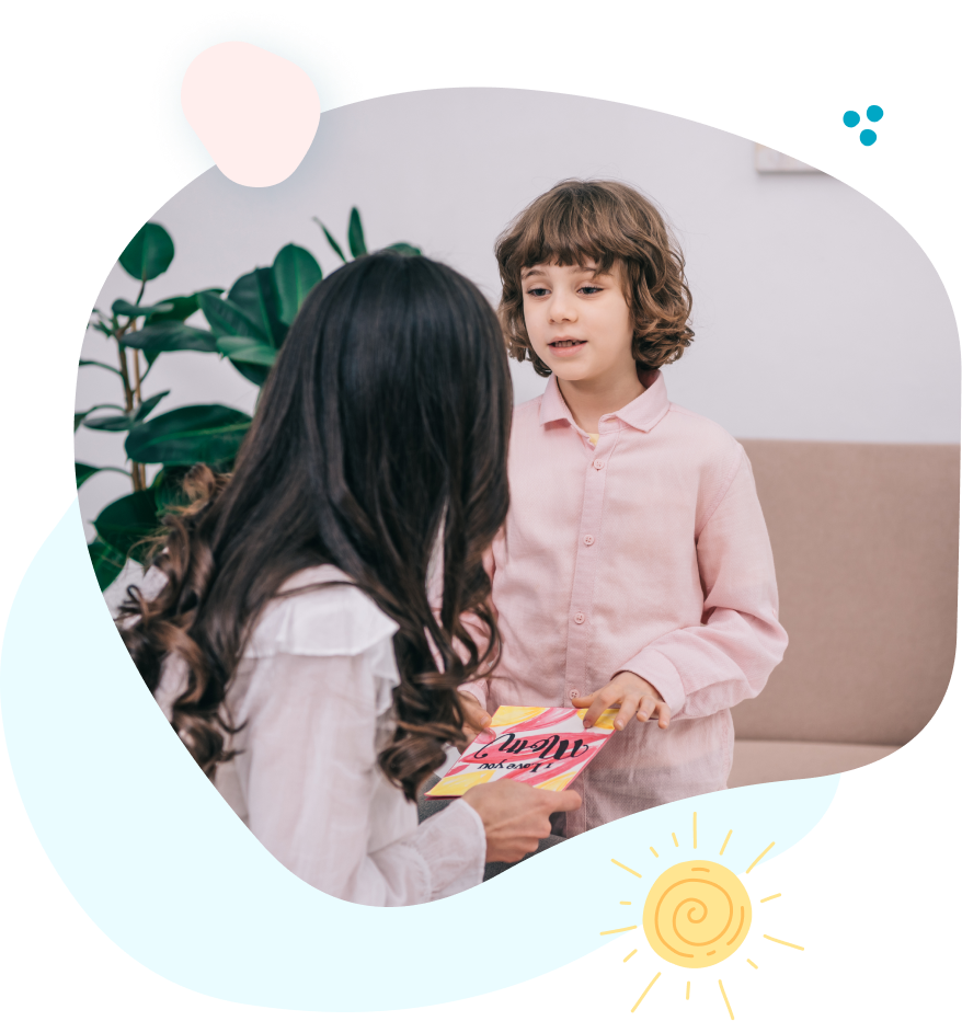 A woman and a little girl are talking to each other in a living room.