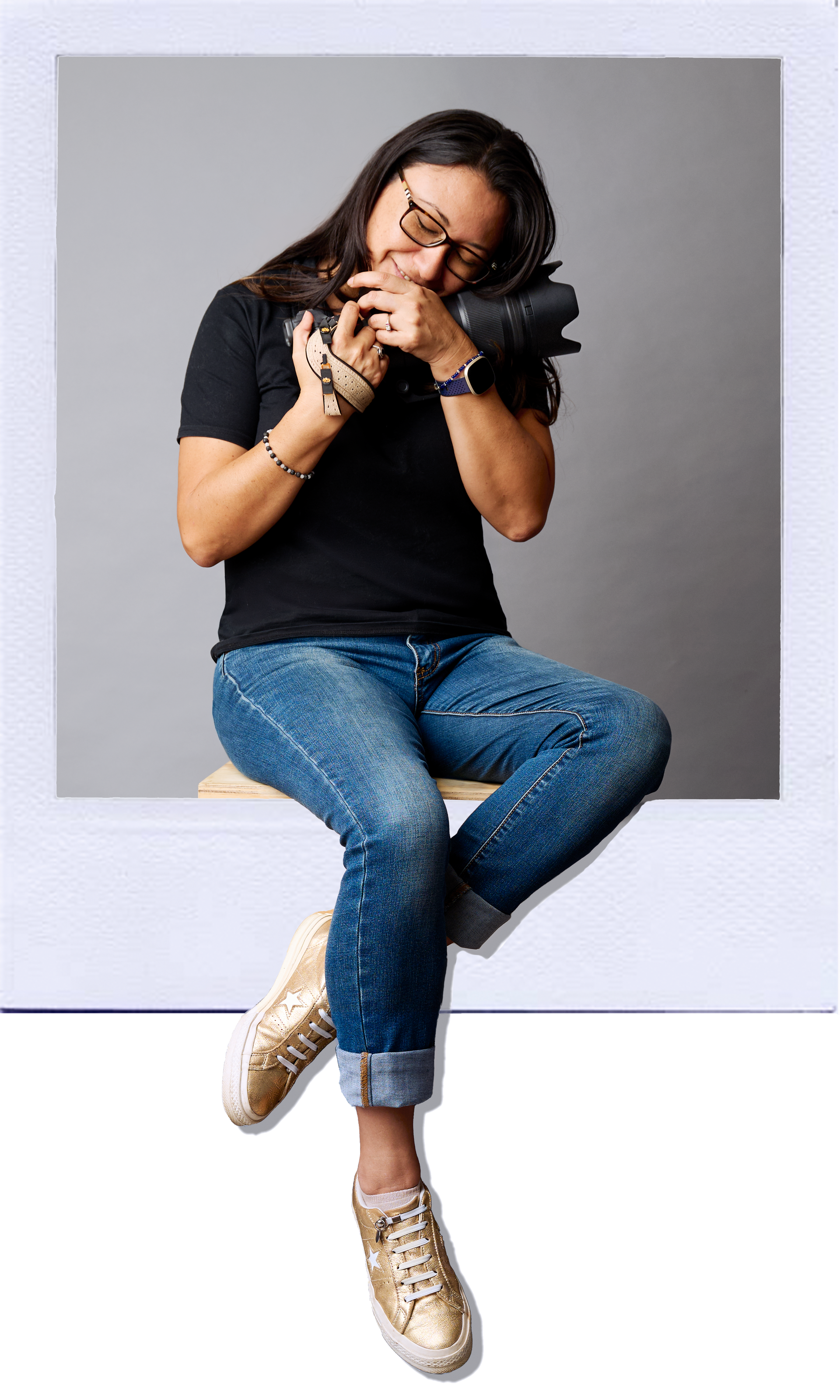 Karem Nunez sitting at the edge of a window frame that looks like a polaroid photo.