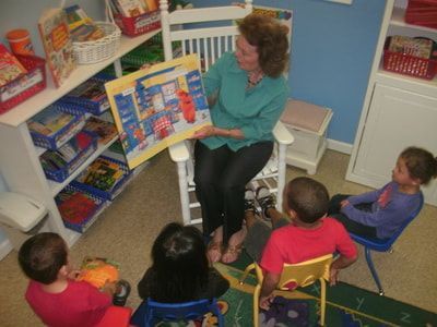 Woman reading with children