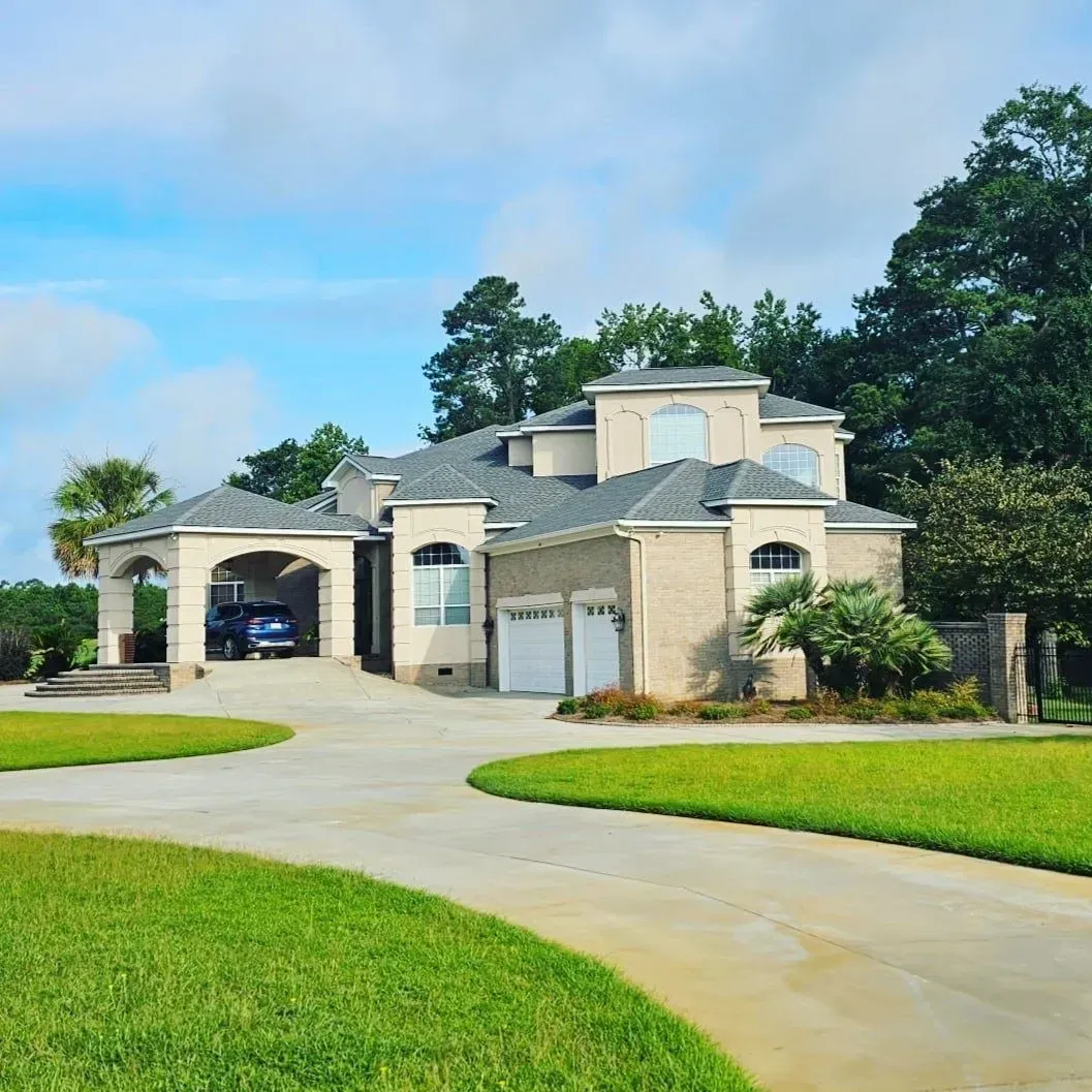 A large house with a car parked in front of it