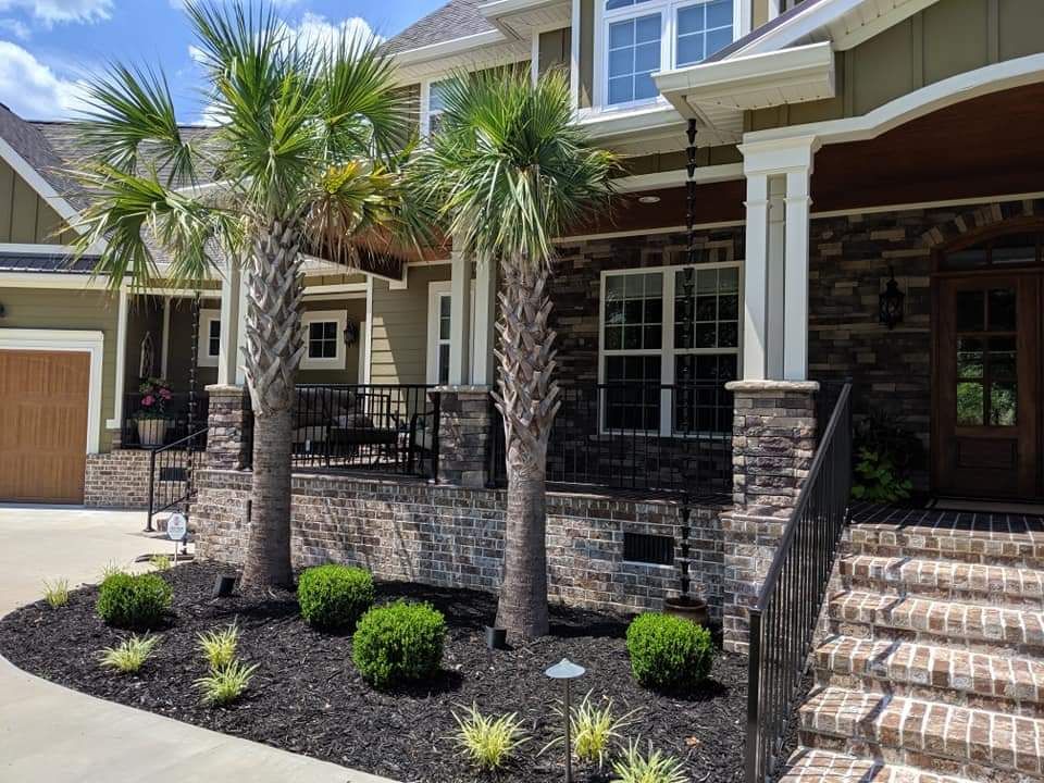 A large house with palm trees in front of it