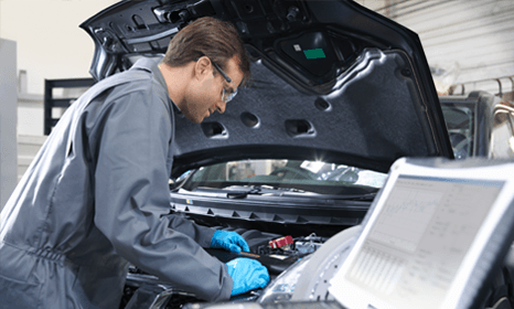 a mechanic offering computerised car engine diagnostics