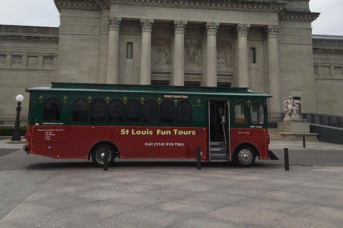 A st louis fun tours bus is parked in front of a building