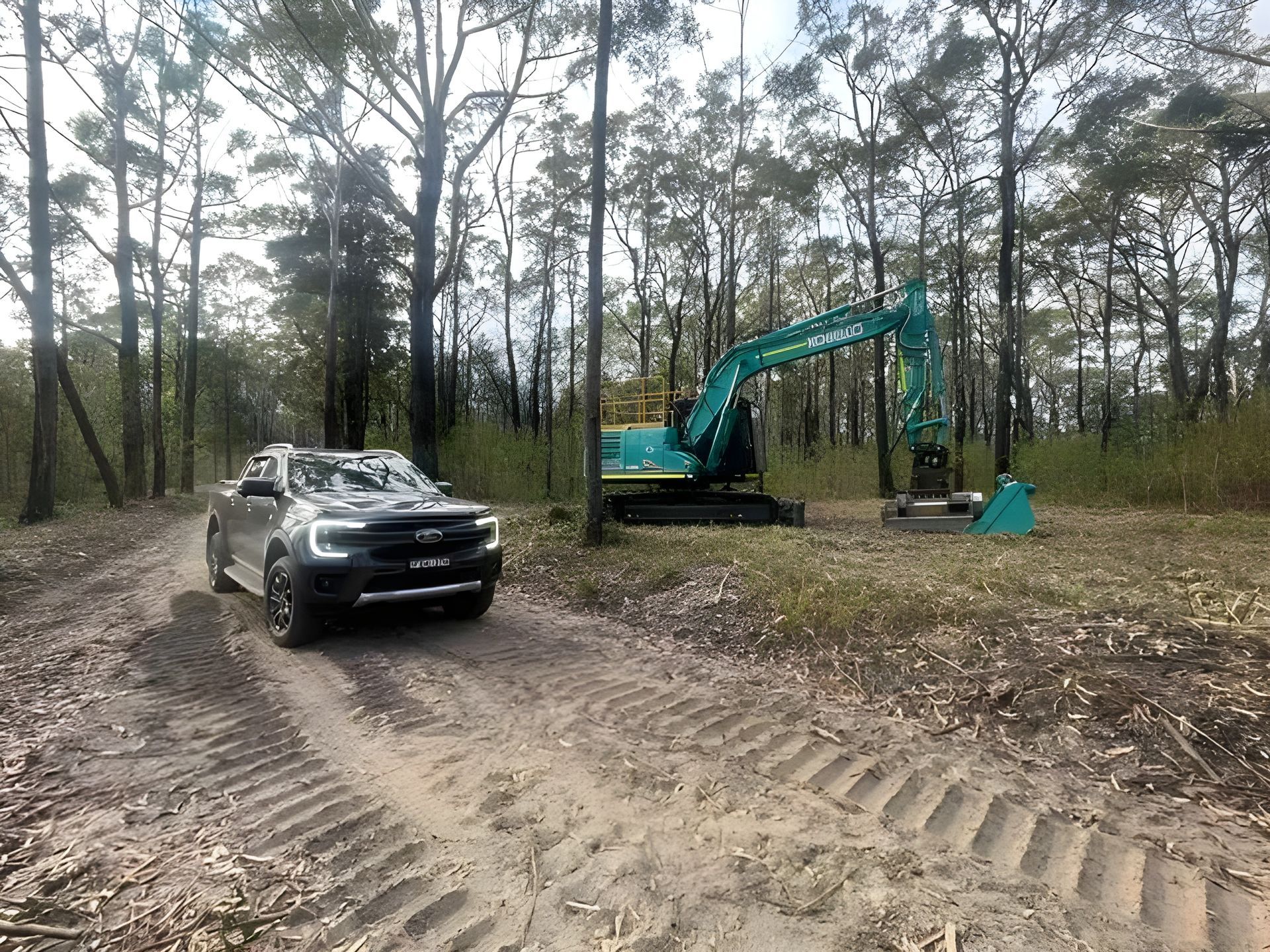 Excavator and Ute Parked on a Dirt Track — Plant Operator Courses Central Coast