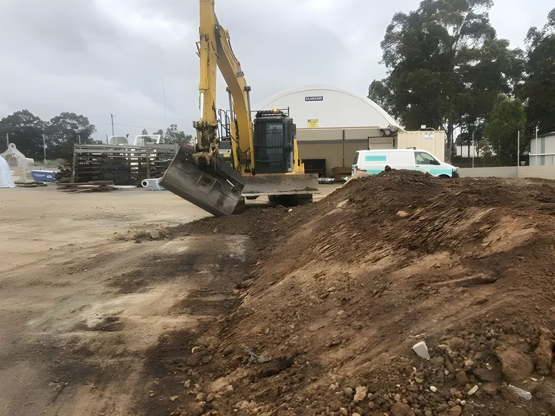 Excavator Working with a Dirt Pile — Statement of Attainment Maitland