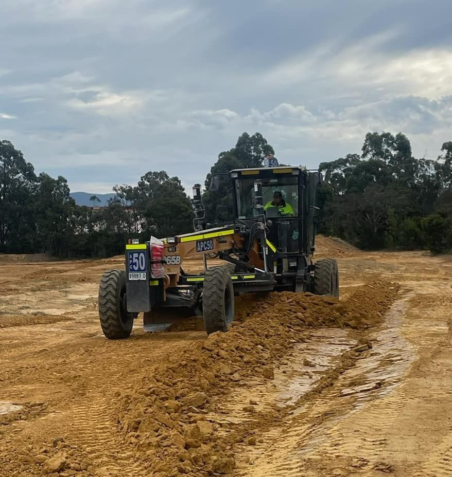 Grader Truck on a Dirt Field — Heavy Machinery in Hunter Region