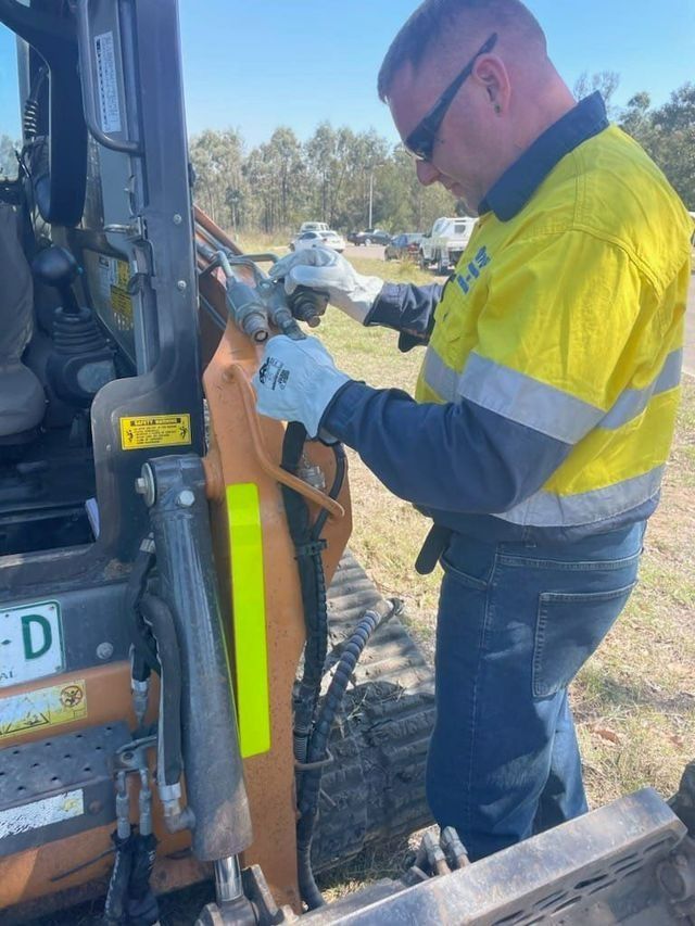 Man Fixing Forklift — Plant Operator Courses Port Macquarie