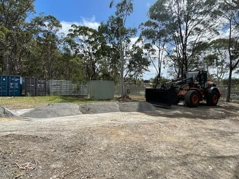 Backhoe Loader Working with Sand — Verification of Competency Muswellbrook