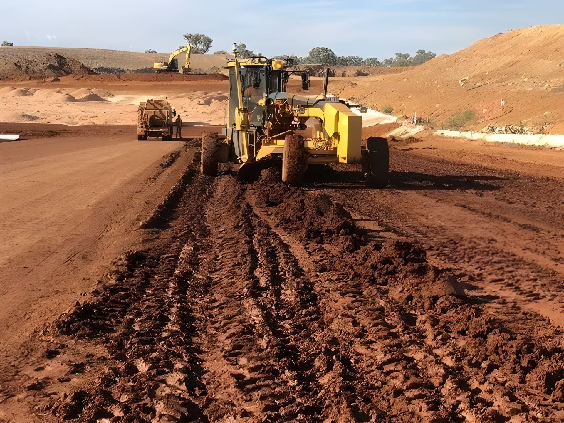 Construction vehicle smoothing out dirt path — Statement of Attainment Newcastle