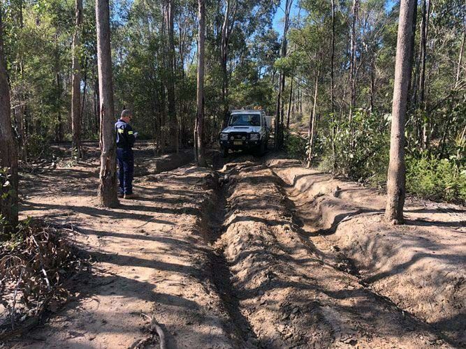 Inspector Watching As Learner Drives An Off-Road Vehicle On A Dirt Path — Verification of Competency Maitland
