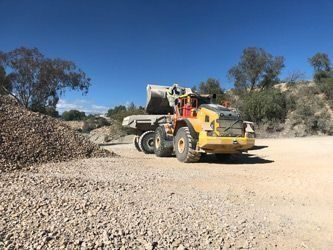 Bulldozer Loading A Truck — Verification of Competency Newcastle