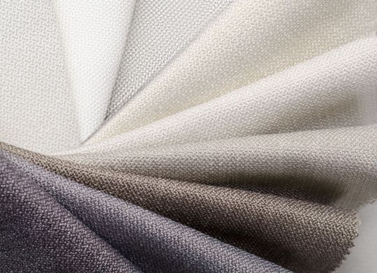 A close up of a piece of fabric that is white and black