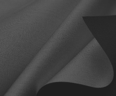 A close up of a piece of grey fabric on a black background.