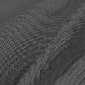 A close up of a piece of grey fabric on a black background.
