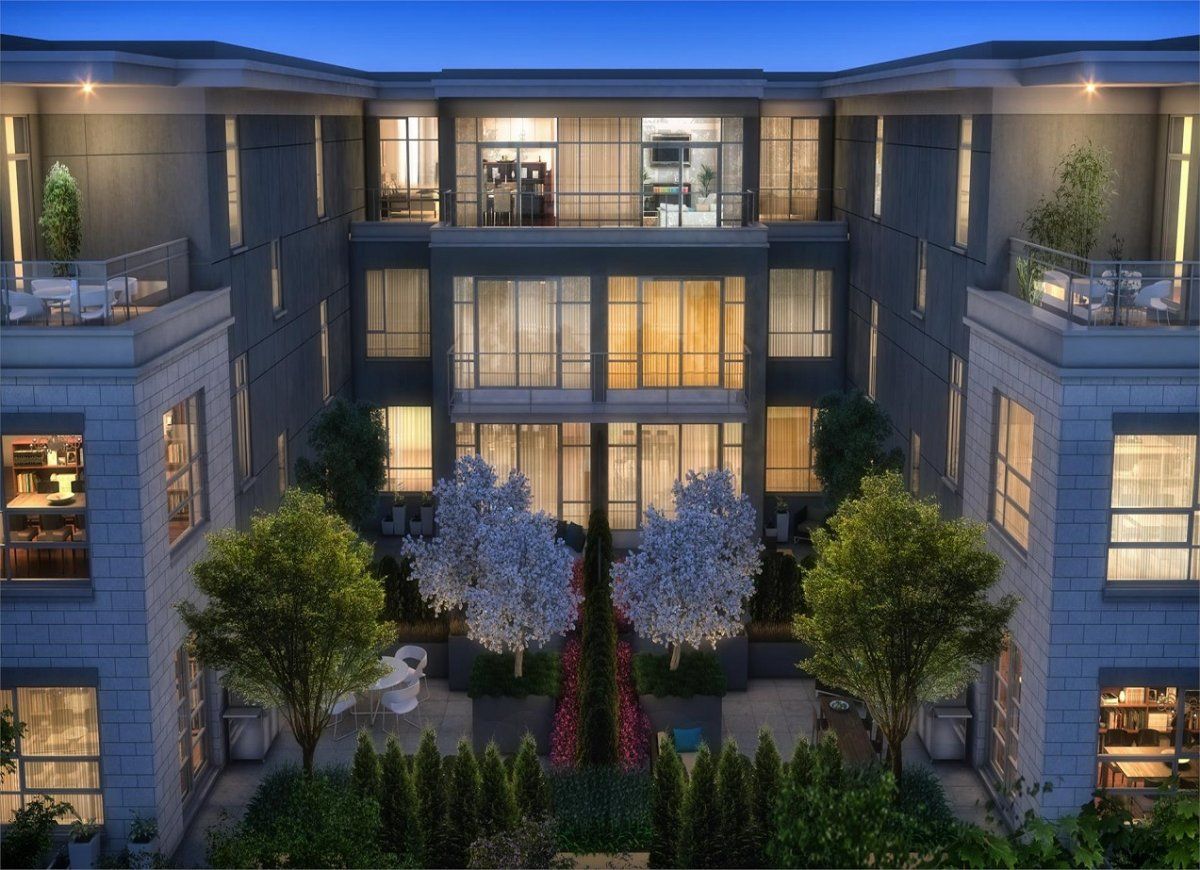 An artist 's impression of a large apartment building at night