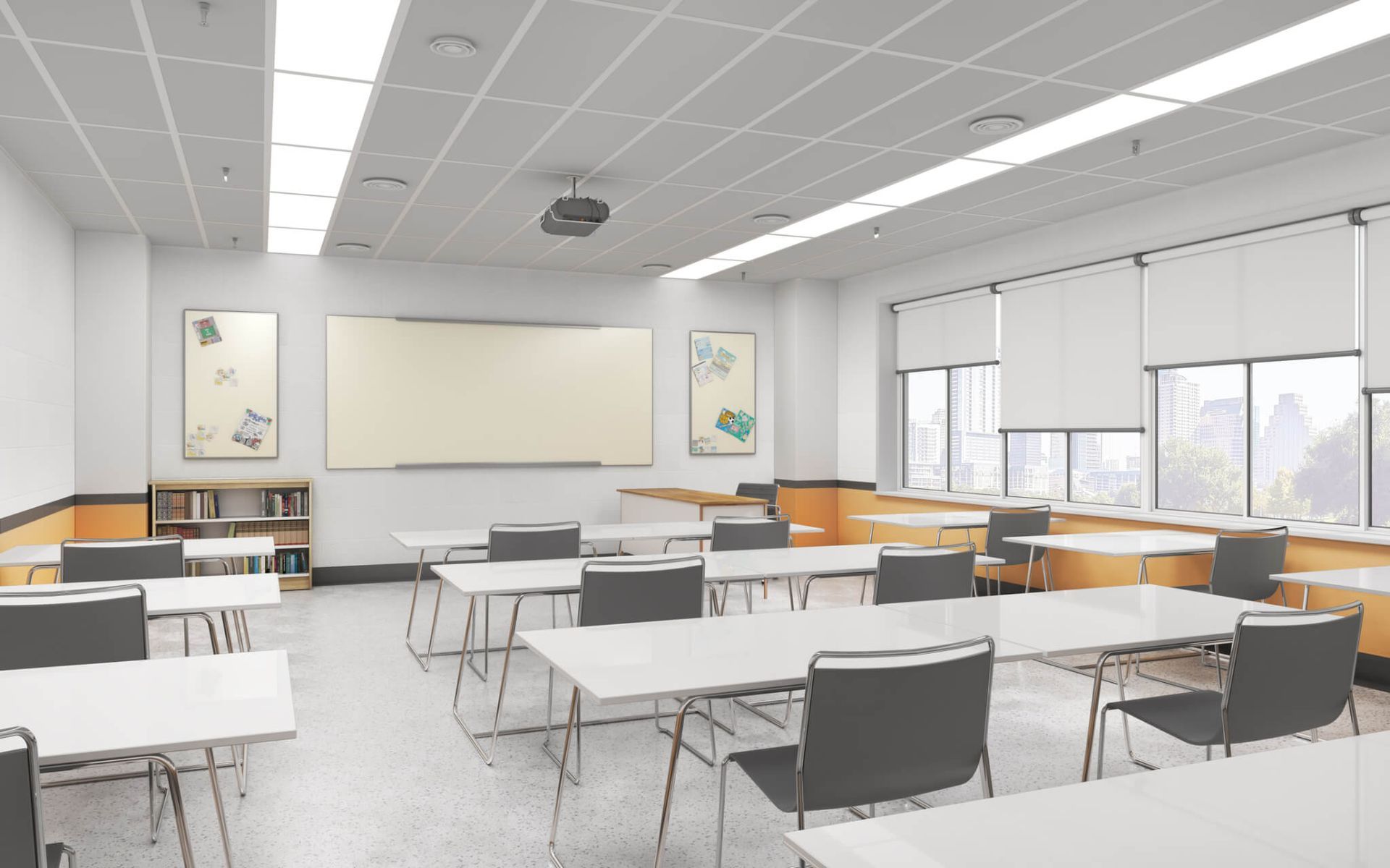 An empty classroom with tables and chairs and a whiteboard.