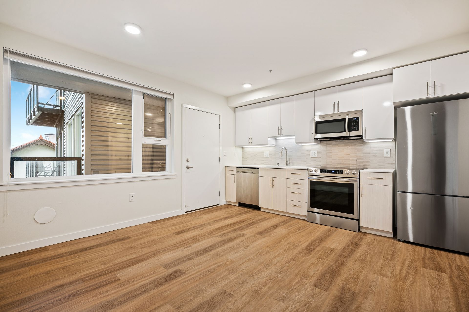 Photo of a living room and kitchen area
