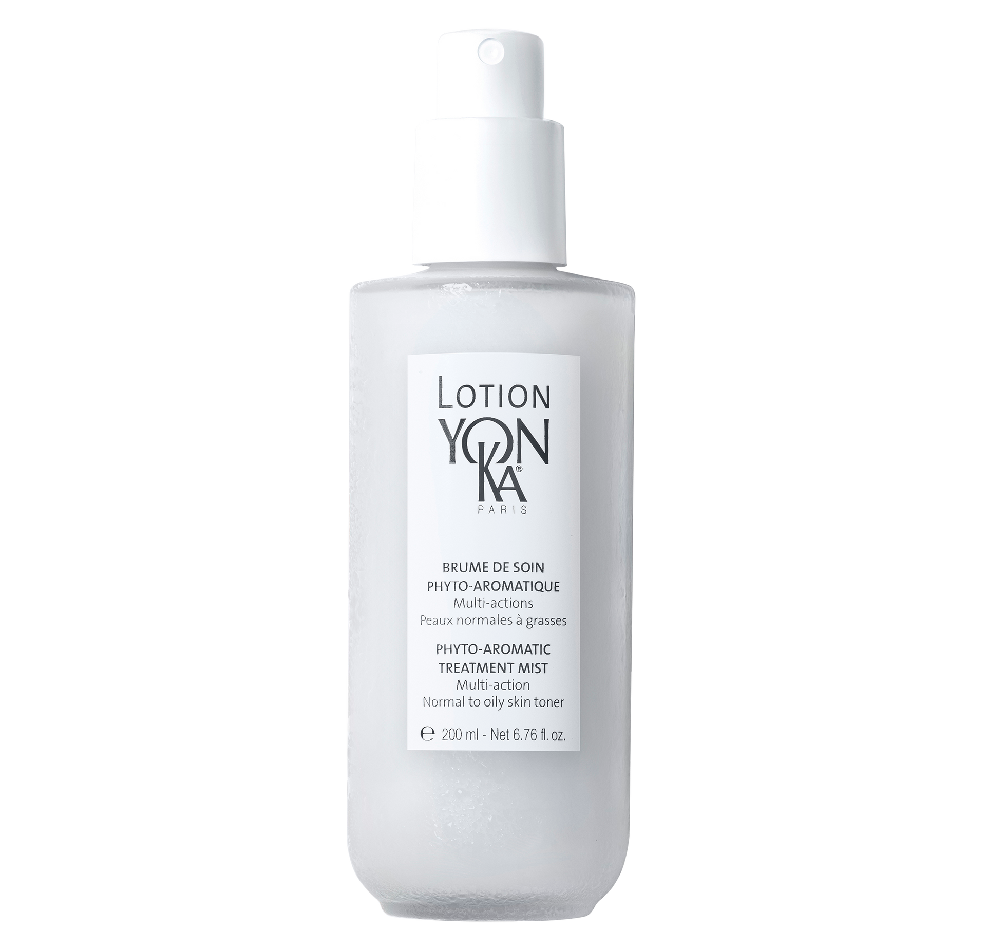 White bottle of Yon-Ka lotion with a spray nozzle. Gray text on the label.