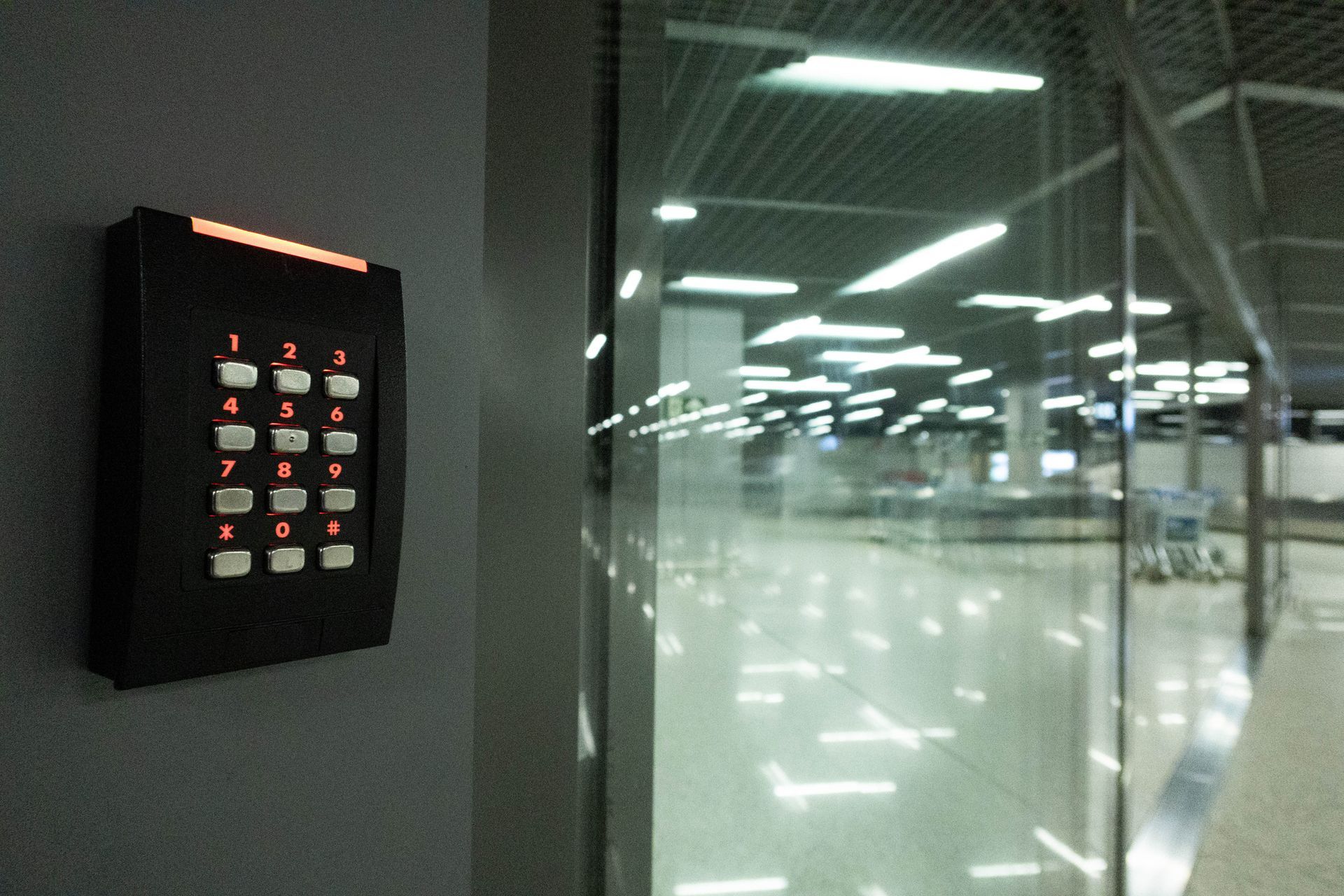 A person is using a fingerprint scanner to open a door.