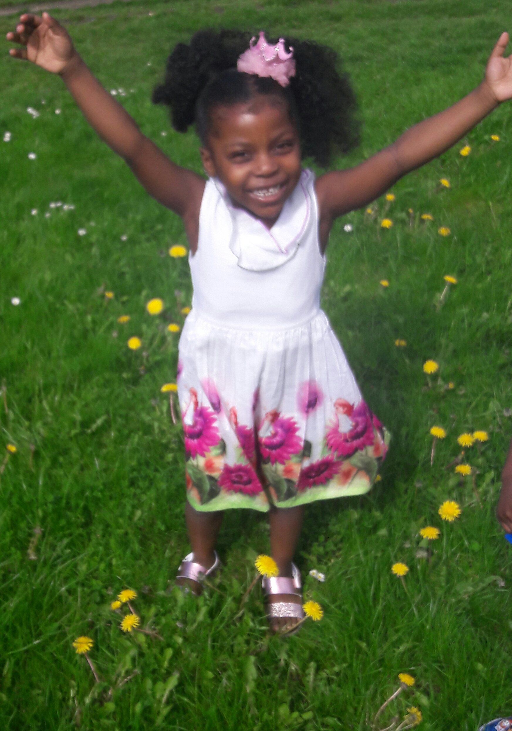 a cute baby girl wear purple tops and jeans