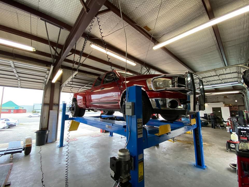 Red Truck on Auto Repair Shop — Killeen, TX — Alignment & Brakes Specialist