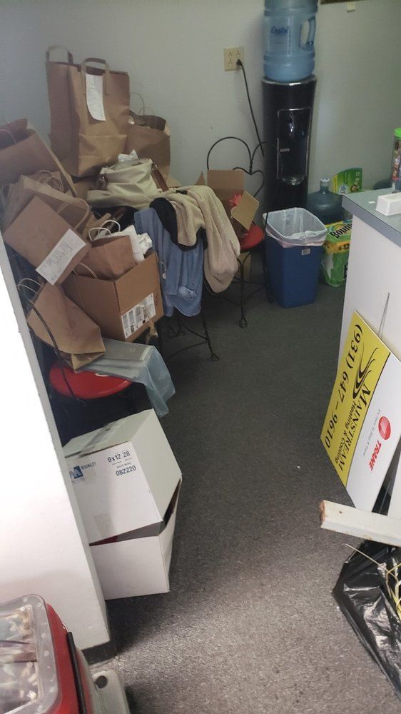 A room filled with lots of boxes and a water cooler.