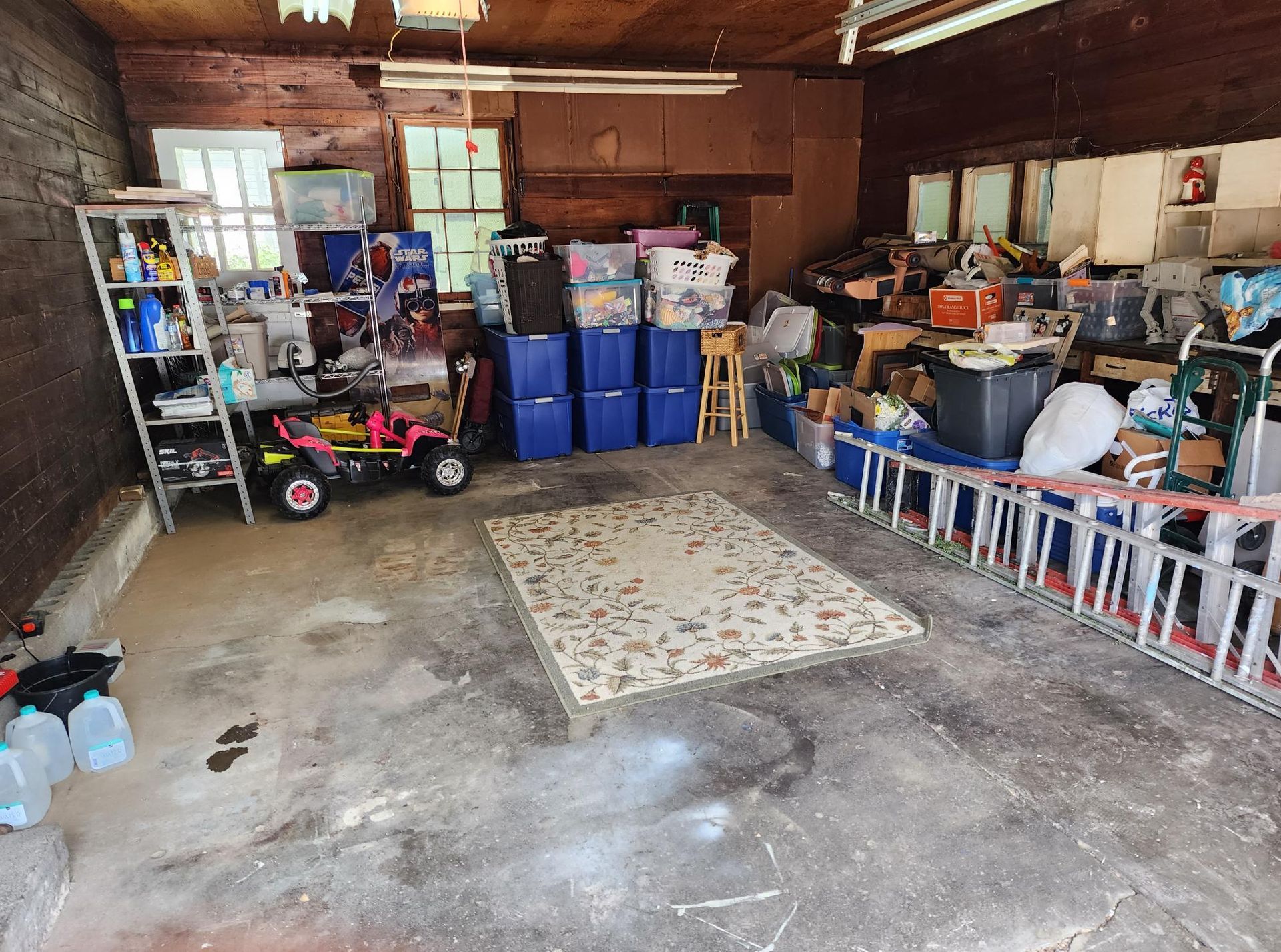 A garage filled with lots of boxes and toys.