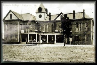 A black-and-white vintage photograph of the Lafayette College building in Alabama, featuring a large, two-story brick hall.