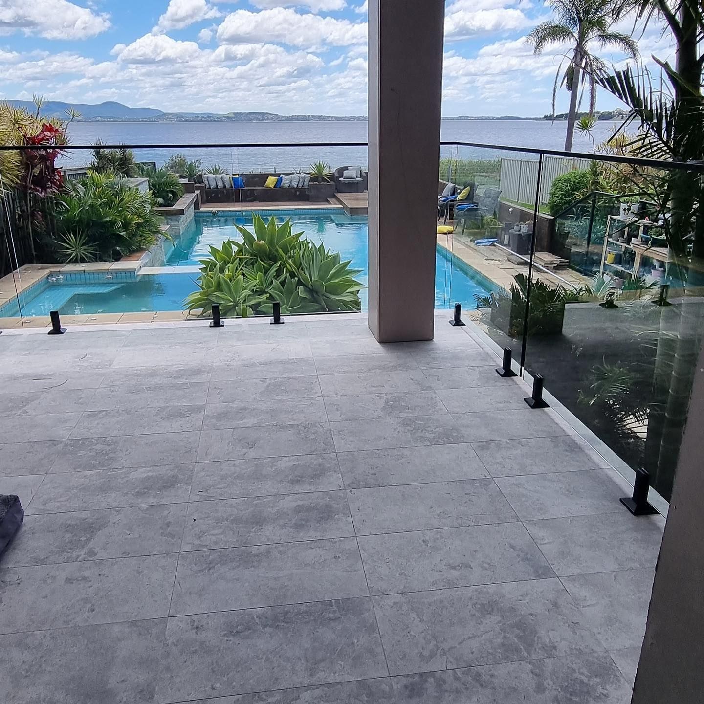 Backyard With Large Fencing Around Swimming Pool — Glass in Wollongong, NSW