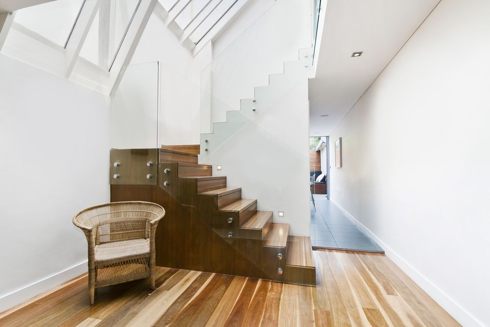 Solid Wooden Stairs With Elegant Glass Balustrade — Glass in Wollongong, NSW