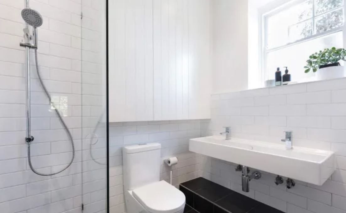 Renovated bathroom with frameless shower screen