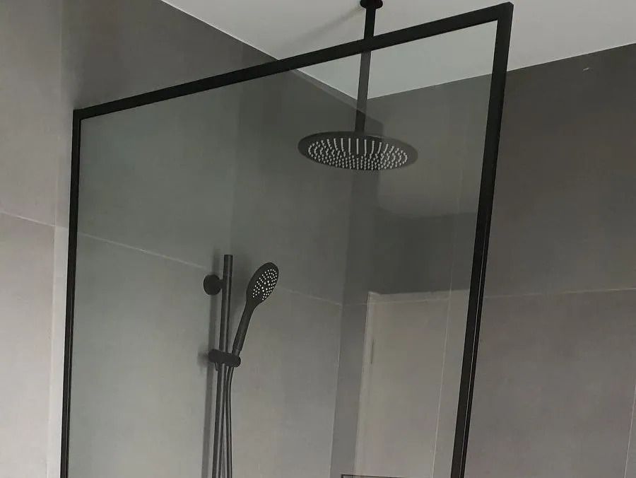 Shower Head is Hanging from the Ceiling in a Bathroom — Glass in Albion Park, NSW