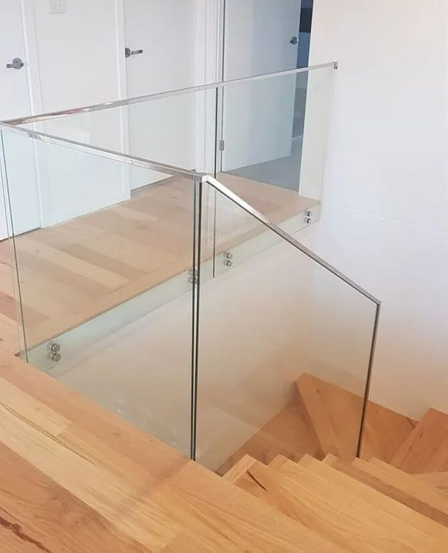 Glass Balustrade Along Wooden Staircase — Glass in Wollongong, NSW