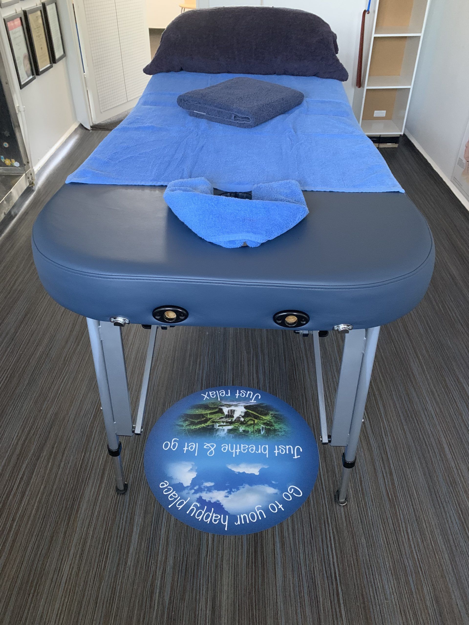 A Blue Massage Table With A Blue Pillow On Top Of It – Chermside, QLD - Hands From Heaven Remedial Therapy Clinic