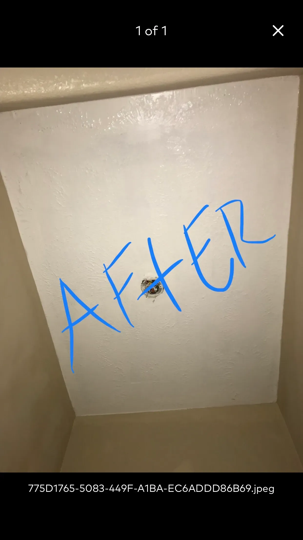 White ceiling in a bathroom after renovation, with blue 