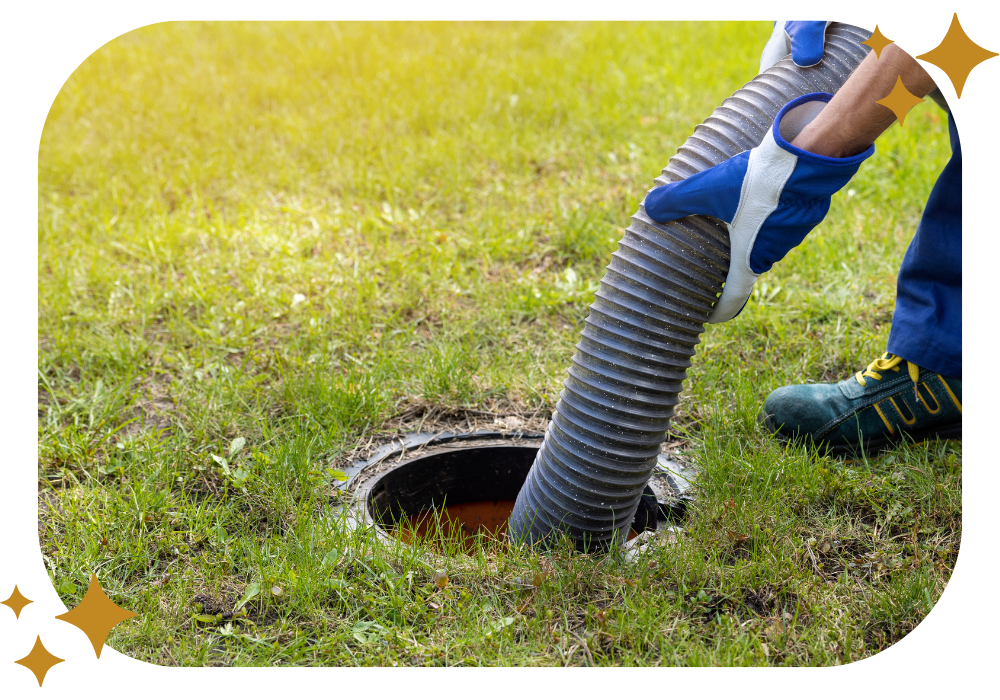 A person is pumping a hose into a septic tank.