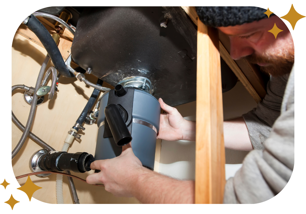 A man is fixing a garbage disposal in a kitchen