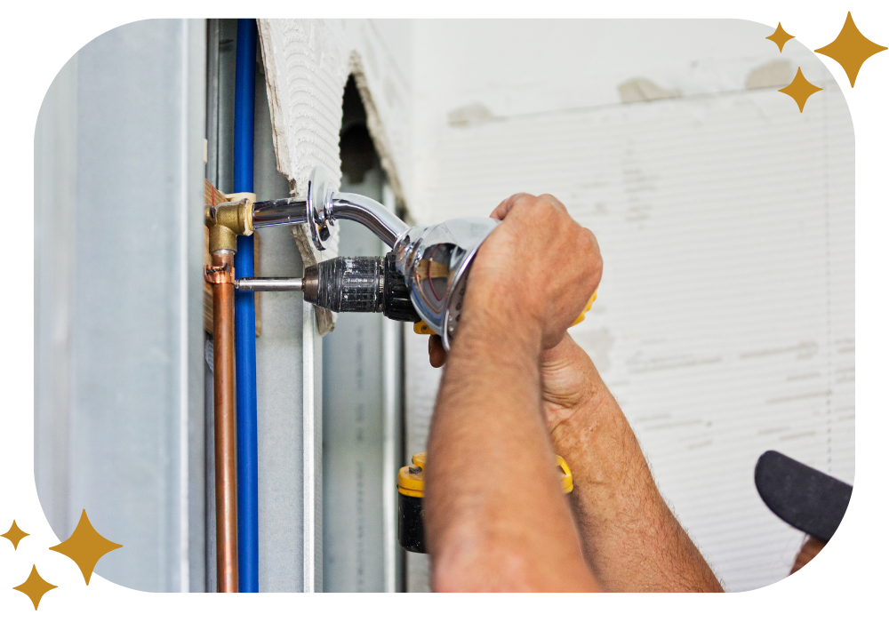 A man is working on a pipe with a drill.