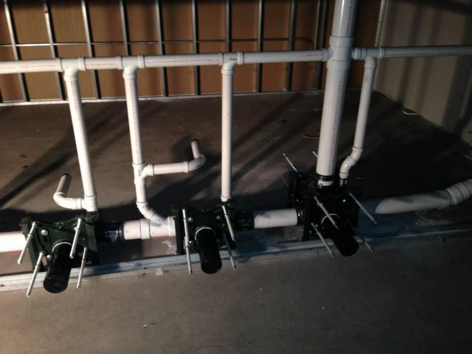 A bunch of pipes are lined up in a room