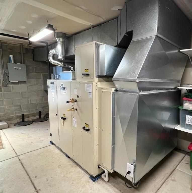 A room with a lot of metal appliances in it.