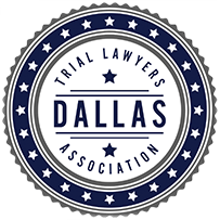 The dallas trial lawyers association logo is a blue and white seal with stars.