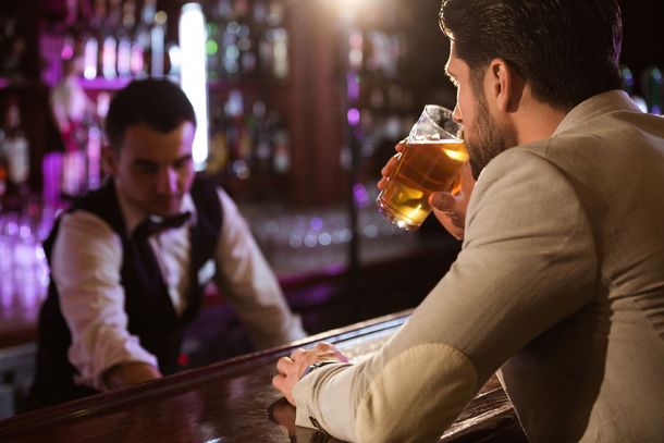 Man Drinking at Bar