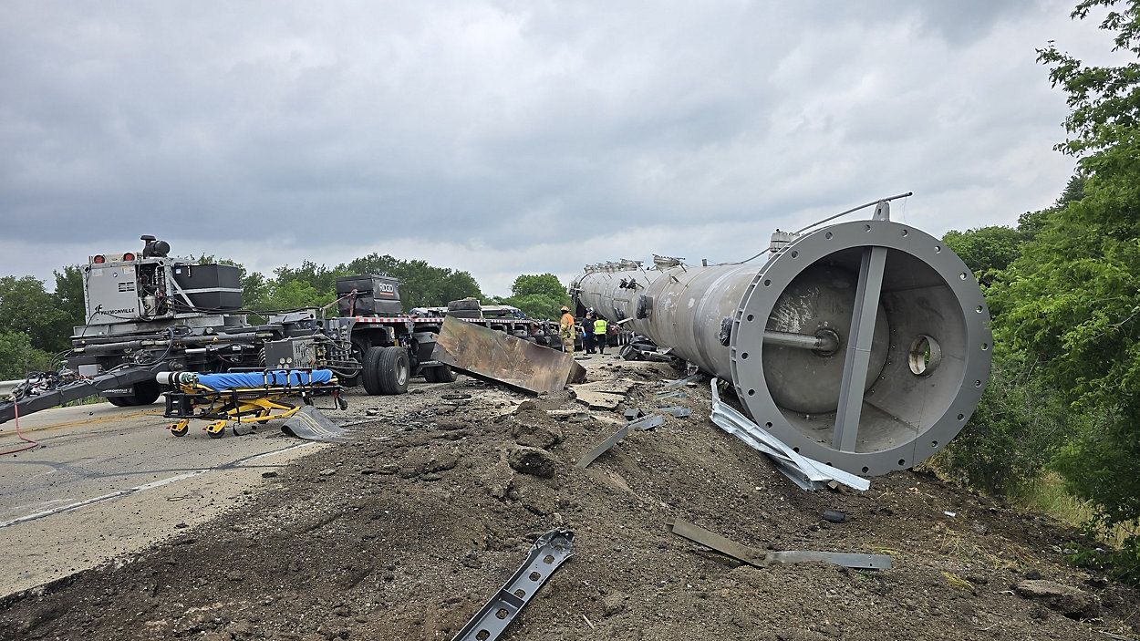 18-wheeler causes double fatality when its 350,000-pound load came off and crushed a small car.