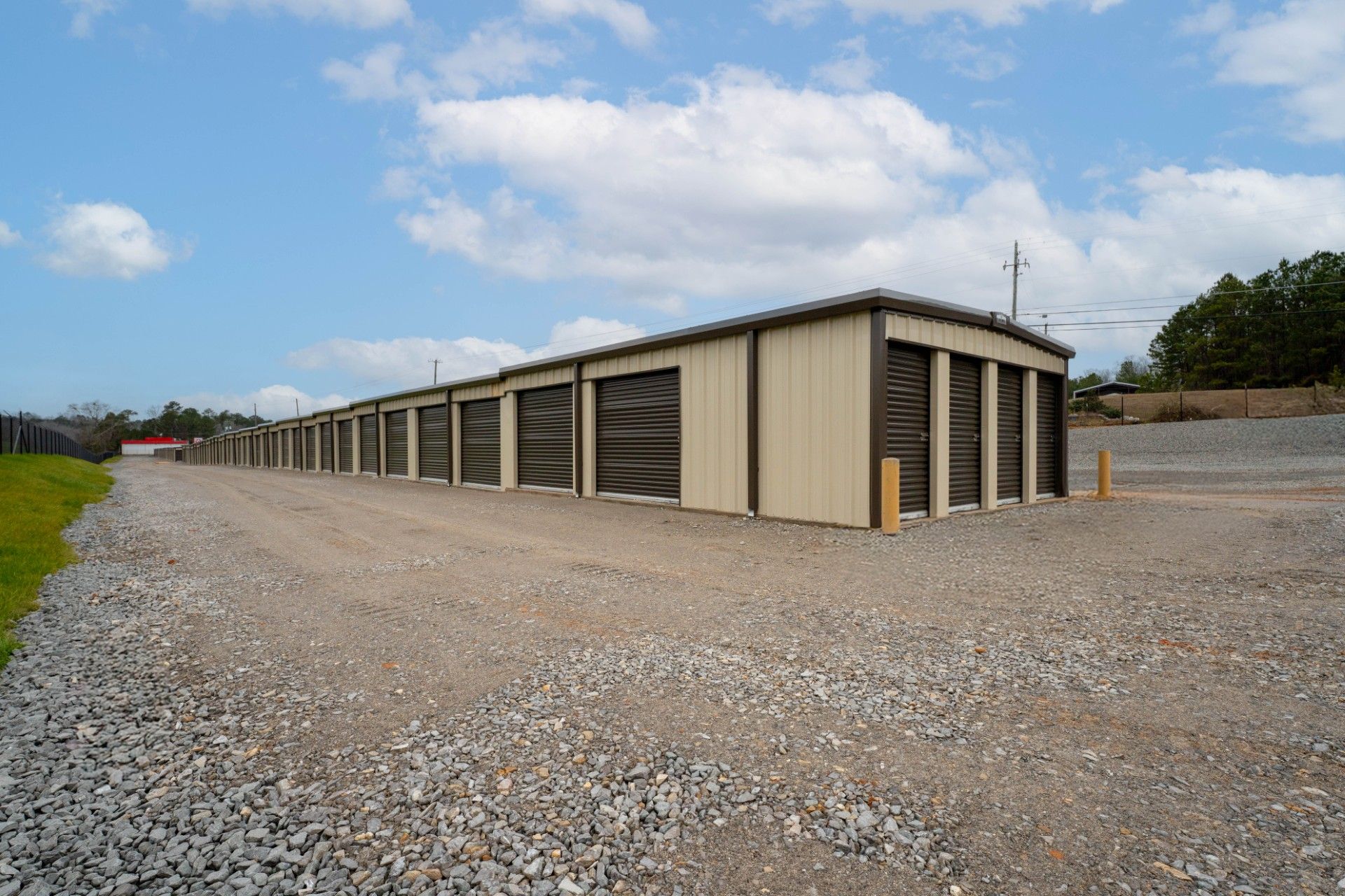 A row of green and white storage units in a hallway.