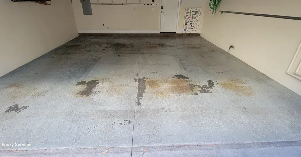 Garage interior with stained concrete floor.