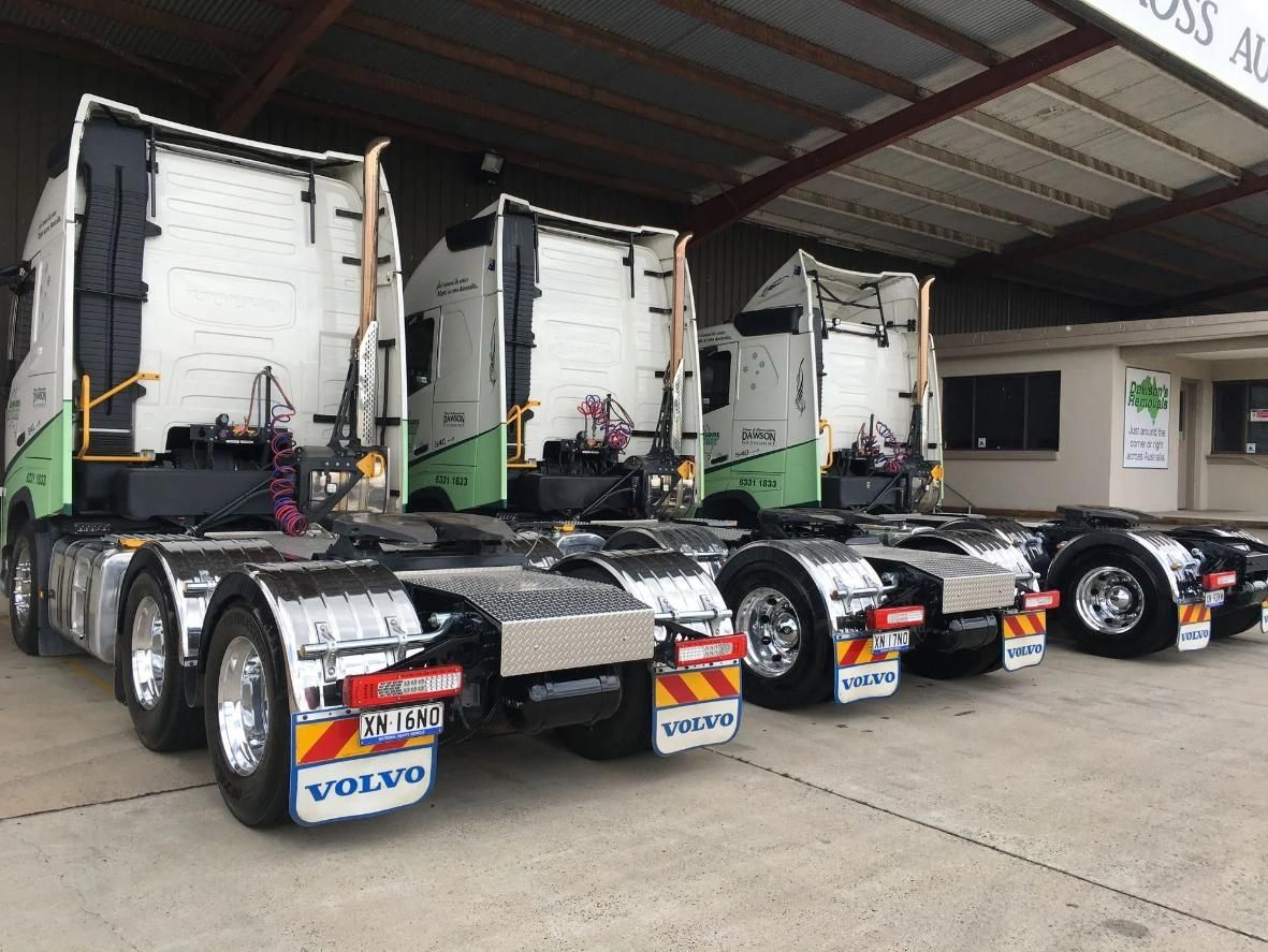 Three White Tractor Cabs Parked in A Warehouse — Dawson's Removals In Kelso, NSW