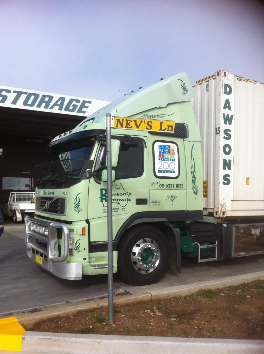 Light Green Dawsons Moving Truck Parked Outside a Storage Facility — Dawson's Removals In Kelso, NSW