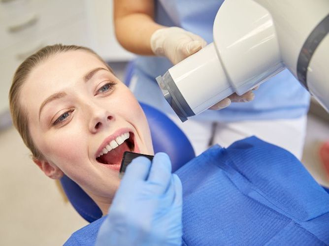 woman getting radiation x-ray
